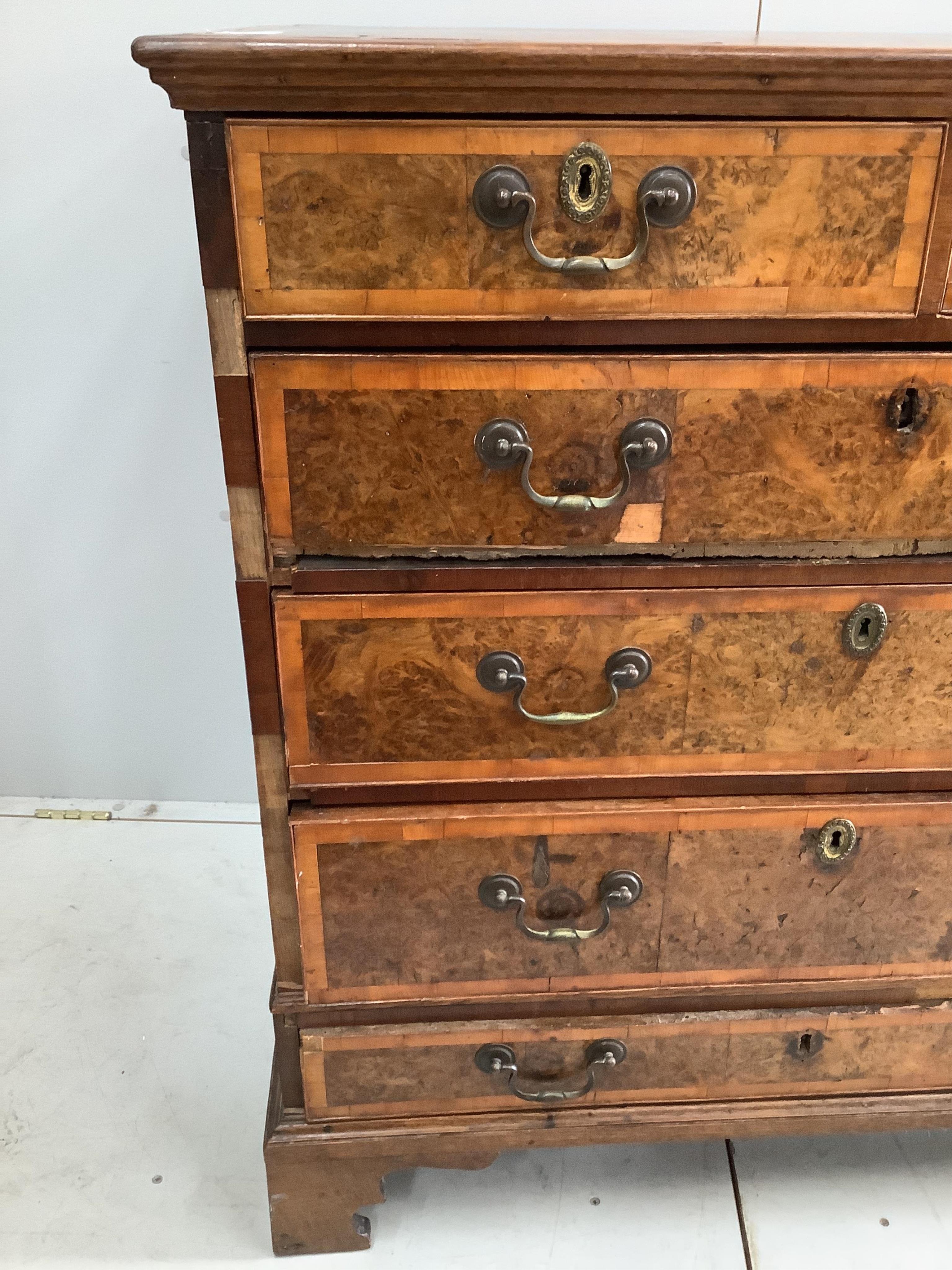A mid 18th century and later crossbanded walnut and oak chest, width 95cm, height 103cm. Condition - poor